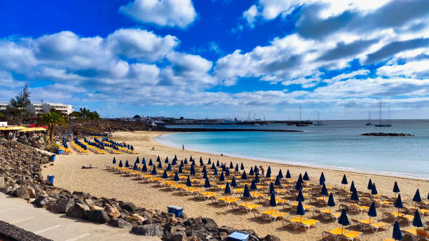 playa dorada beach, playa blanca, yaiza municipality, lanzarote, spain - lanzarote bay canary islands beach imagens e fotografias de stock