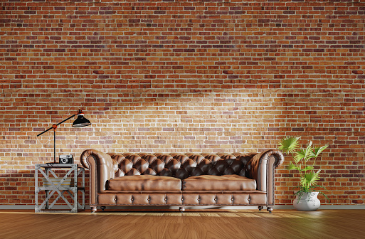 Interior loft concept with a leather sofa and copy space