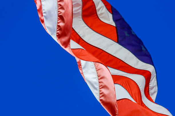 istock USA American flag with waving stars displaying 1368090071