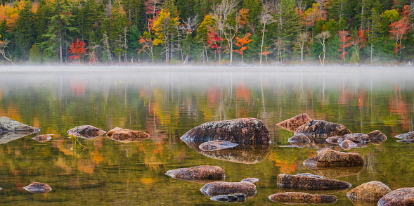 morning fog and mist on the shores of Jordon's  Pond in Acadia national Park in Autumn
