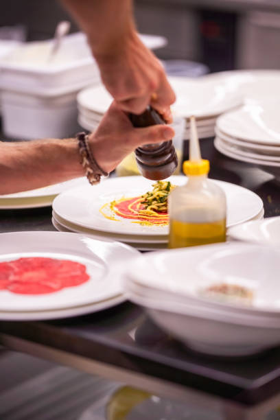 istock Chef preparing a carpaccio dish with zucchini and tomato 1368091218