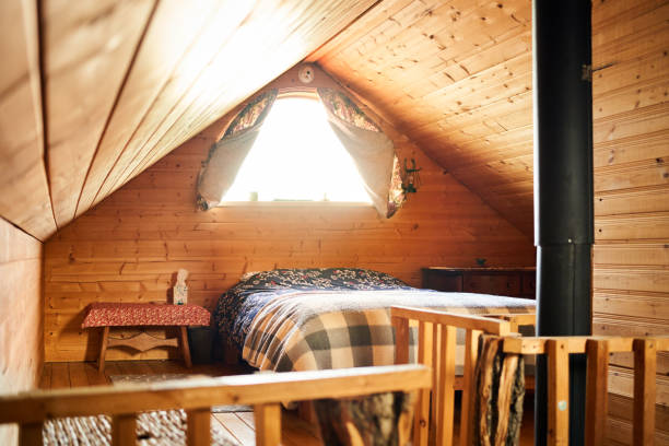 istock Cozy attic bedroom in a rustic wood cabin 1368091274