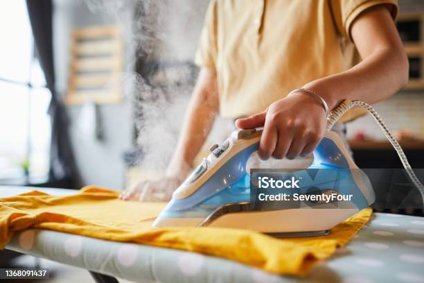 Young Woman Ironing Close Up Stock Photo - Download Image Now - Iron - Appliance, Ironing Board, Steam
