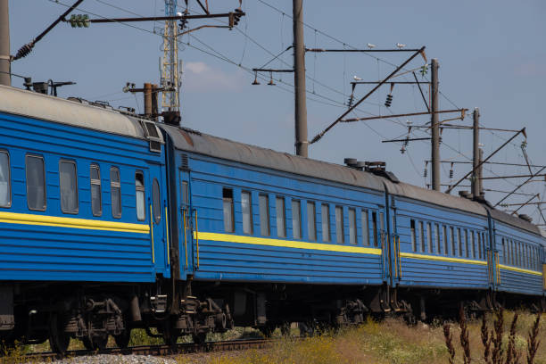 istock Old blue passenger train, carriages on a sunny summer day 1368092533