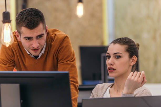 istock Young business colleagues working together on a computer in a comfortable office atmosphere. 1368095168