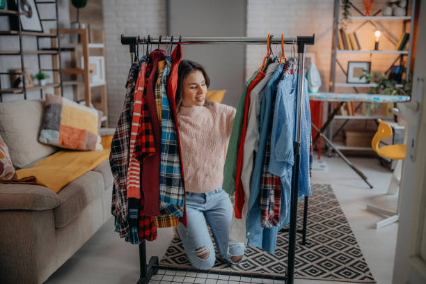 istock Young woman choosing clothes 1368095992