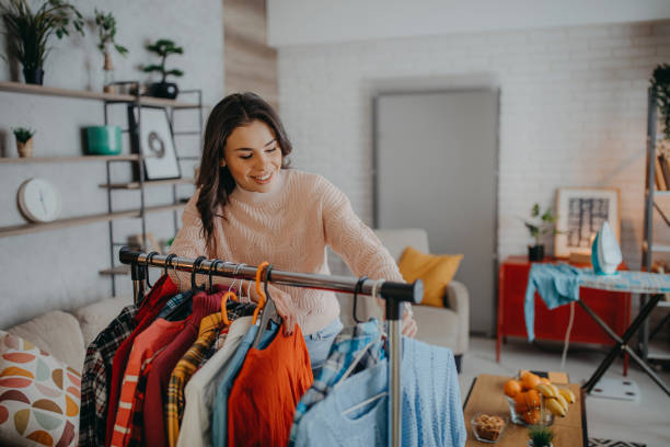istock Young woman choosing clothes 1368096381