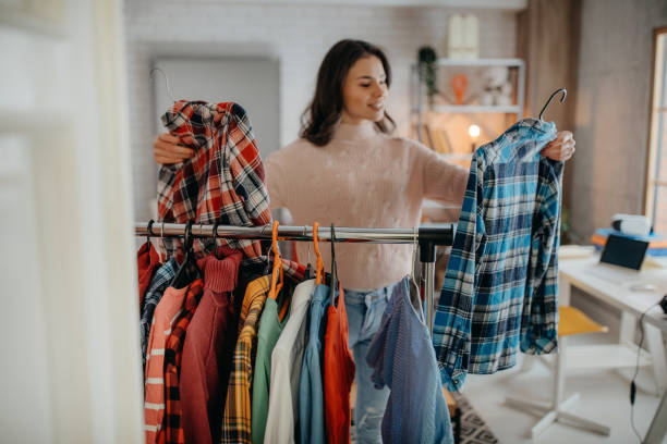 istock Young woman choosing clothes 1368096387