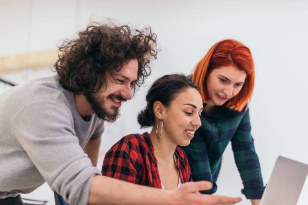istock Group of multi ethnic colleagues discussing helping out each other. Marketing concept. Multi-ethnic society. 1368098289