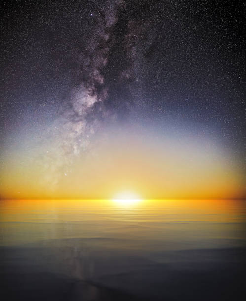 istock Full Moon sets into the horizon next to Milky Way 1368099792