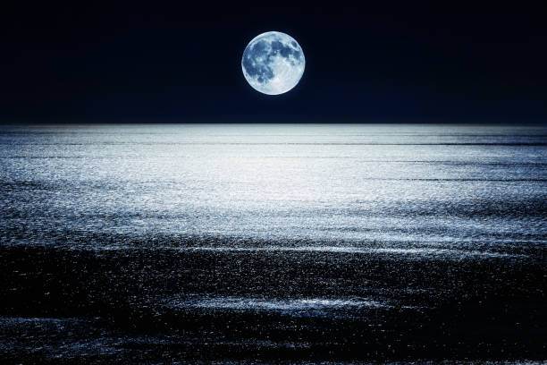 istock Full Moon setting over the Mediterranean Sea 1368099824