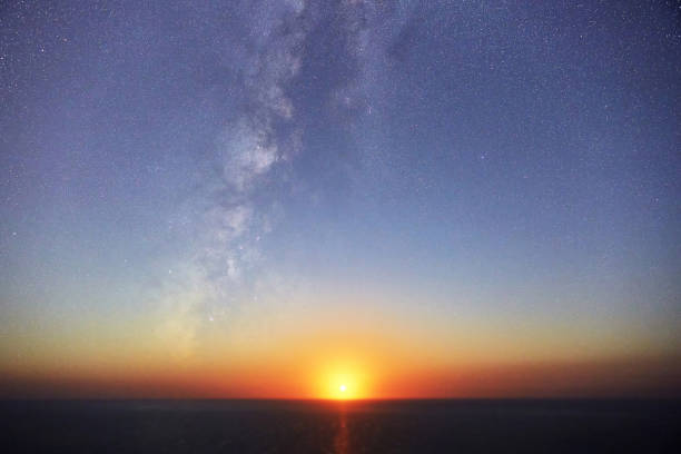istock Moonset over the horizon next to the Milky Way 1368099860