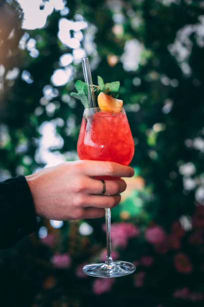 istock Raspberry gin daisy cocktail enjoyed outside in the nature background 1368101126