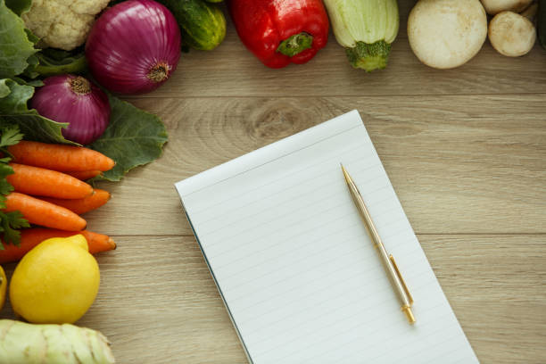 istock Getting inspiration to plan healthy recipe with organic vegetables 1368103351
