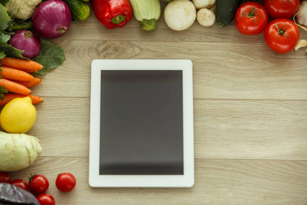 istock Check new recipes with fresh vegetables in your digital tablet 1368103357