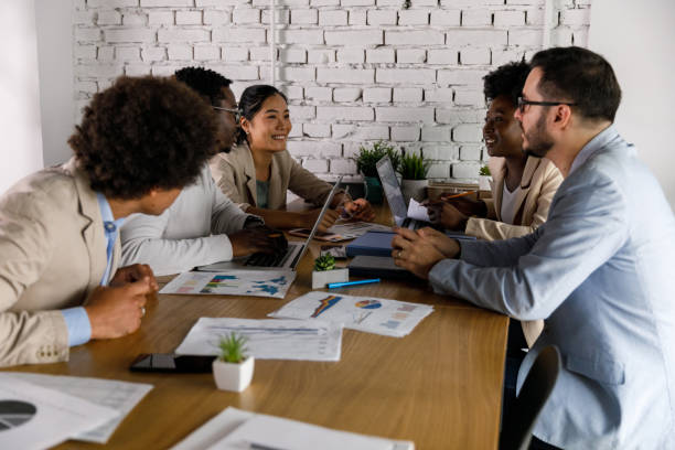 istock Diverse group of business people co-working on a project 1368104303