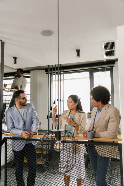 istock Business people hanging out and chatting during coffee break 1368104346
