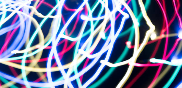 istock Abstract freezelight from green, blue and white stripes on a black 1368106794
