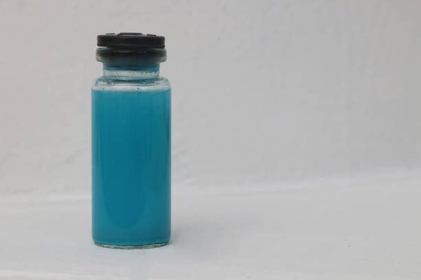 istock Blue ampoule with medicine on light gray background copi spice. 1368110645