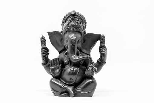 Close up black statue of Lord Ganesha isolated background