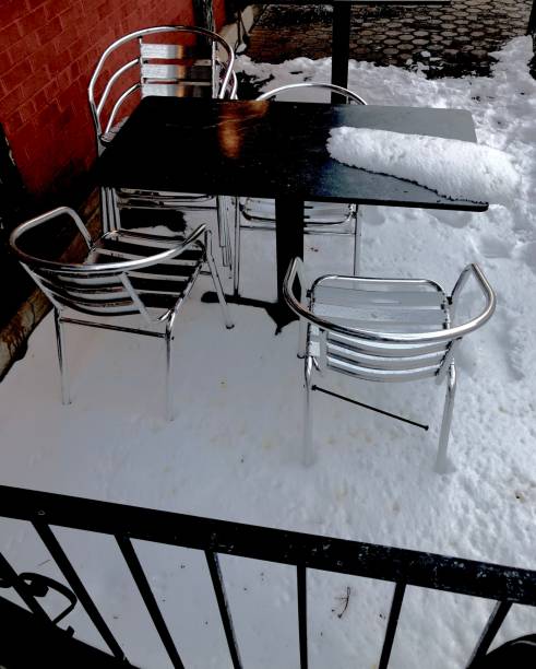 Snow on Outdoor Dining Area