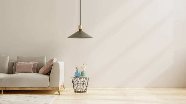 istock Empty living room with sofa,lamp and table on empty white wall background. 1368125855