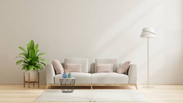 istock Living room interior with brown sofa,lamp,plant and table on empty white wall background. 1368125861