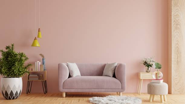 istock Living room interior wall mockup with pink sofa on empty pink wall background. 1368125877