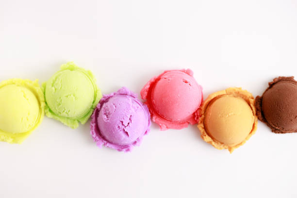 variety of ice cream scoops on white background, top view.