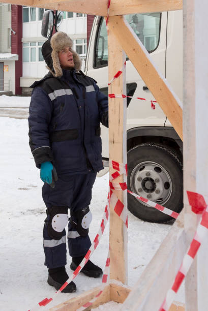 istock Worker assembling the frame of a wooden slide 1368130760