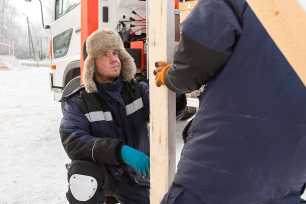 istock Worker assembling the frame of a wooden slide 1368130773