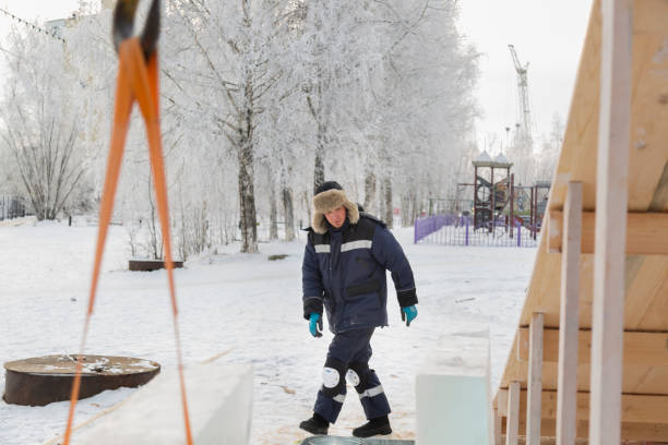 istock Worker assembling the frame of a wooden slide 1368130844