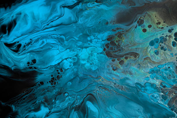 istock Fluid Art. Blue abstract waves with golden particles on black background. Marble effect background or texture 1368133501