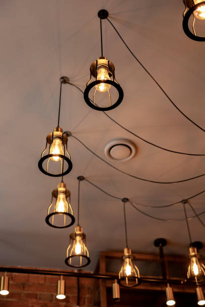 istock Stylish loft cafe. Black lights on the ceiling. Wires. 1368133737