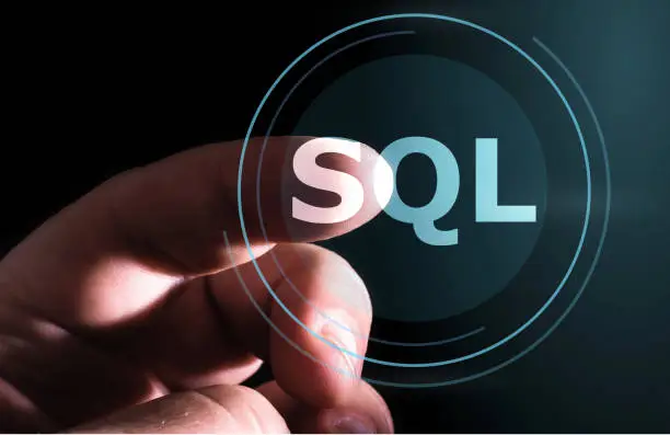 Photo of Hand pressing SQL button on virtual screens