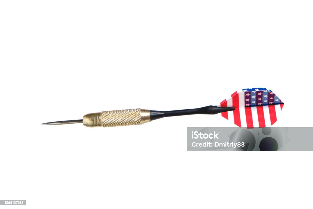 Metal dart for playing darts with color plumage under US flag, on white background. Metal dart for playing darts with color plumage under US flag, on white background Dart Stock Photo