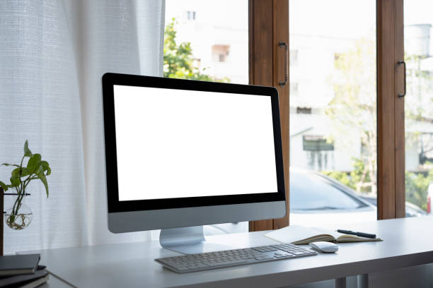istock Modern workplace with computer, books and houseplant on white table. 1368138839