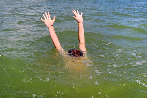 Person with Hands Up in the Water