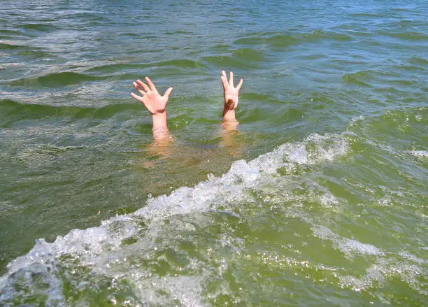 Person with Hands Up in the Water