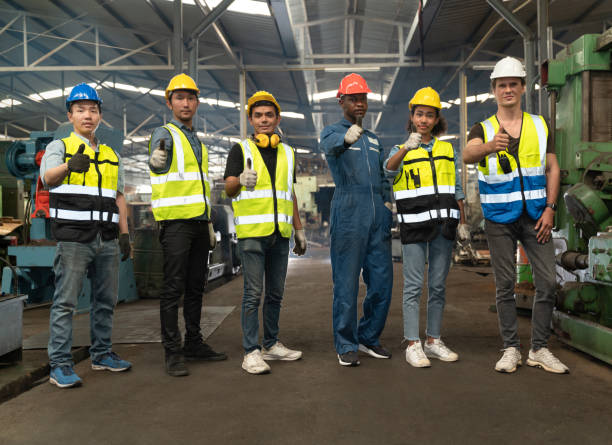 istock Thumb up Team engineer and mechanic at factory 1368140932