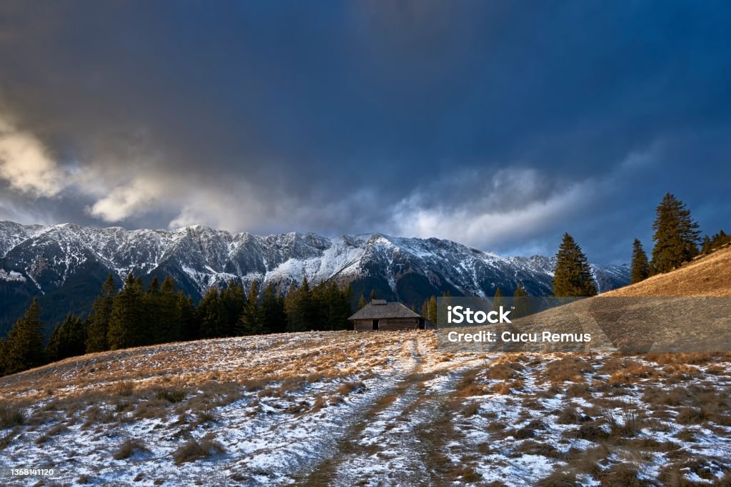 Shepherd cottage in Romania mountains, winter season Cottage Stock Photo