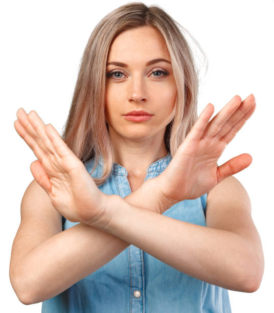 istock Young woman showing two hands stop gesture isolated on white background 1368141784