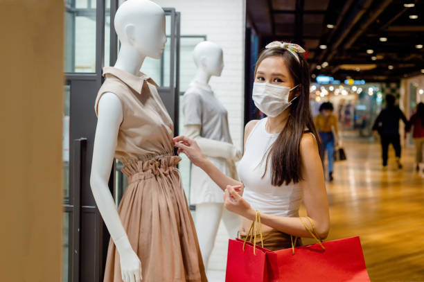 istock woman shopping in mall 1368144167