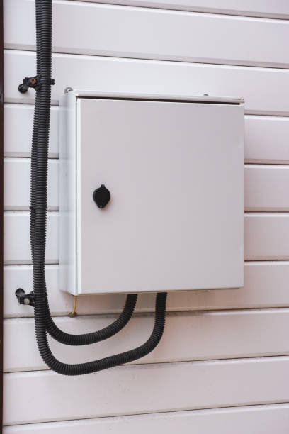 istock Gray Electrical panel with an electric wires in it on a wall outside the house. 1368146367