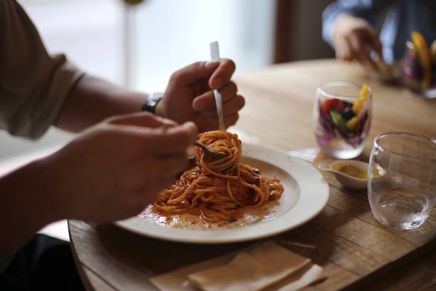 istock eating tomato sauce pasta at the Italian restaurant 1368146603