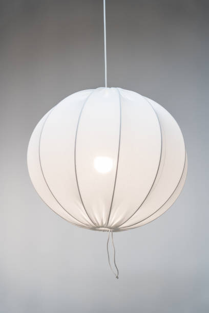 istock White modern pendant lamp, fabric spherical chandelier in Scandinavian style on grey background 1368146792