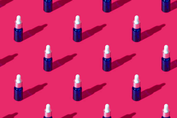 istock Cosmetic bottle mockup with cosmetics on pink background with hard shadows, with copy space closeup. pattern 1368146831
