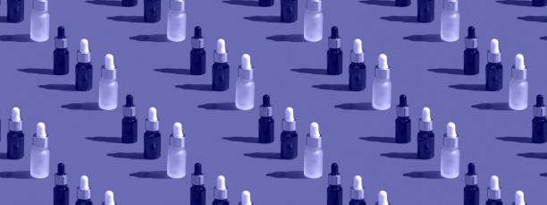 istock Cosmetic bottle mockup with cosmetics on very peri background with hard shadows, closeup copy space 1368146845