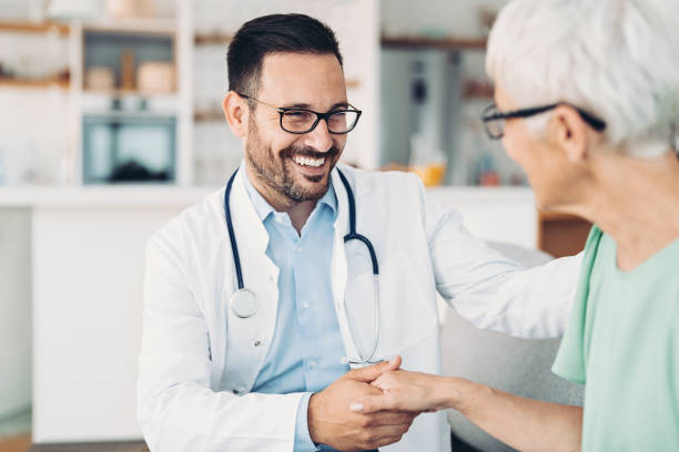 Smiling doctor with senior patient