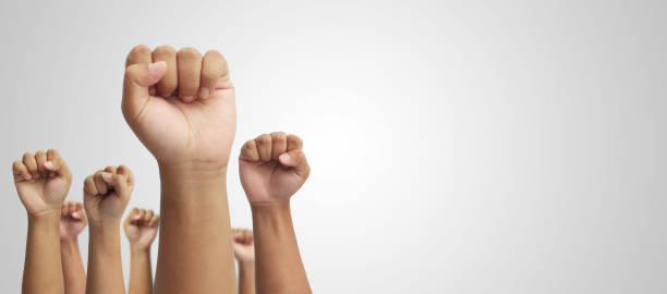 Hands of people raising up in the air fighting for the rights stock photo